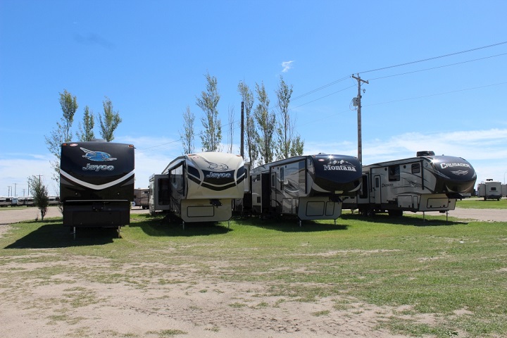 A row of high-quality RV campers on display. 